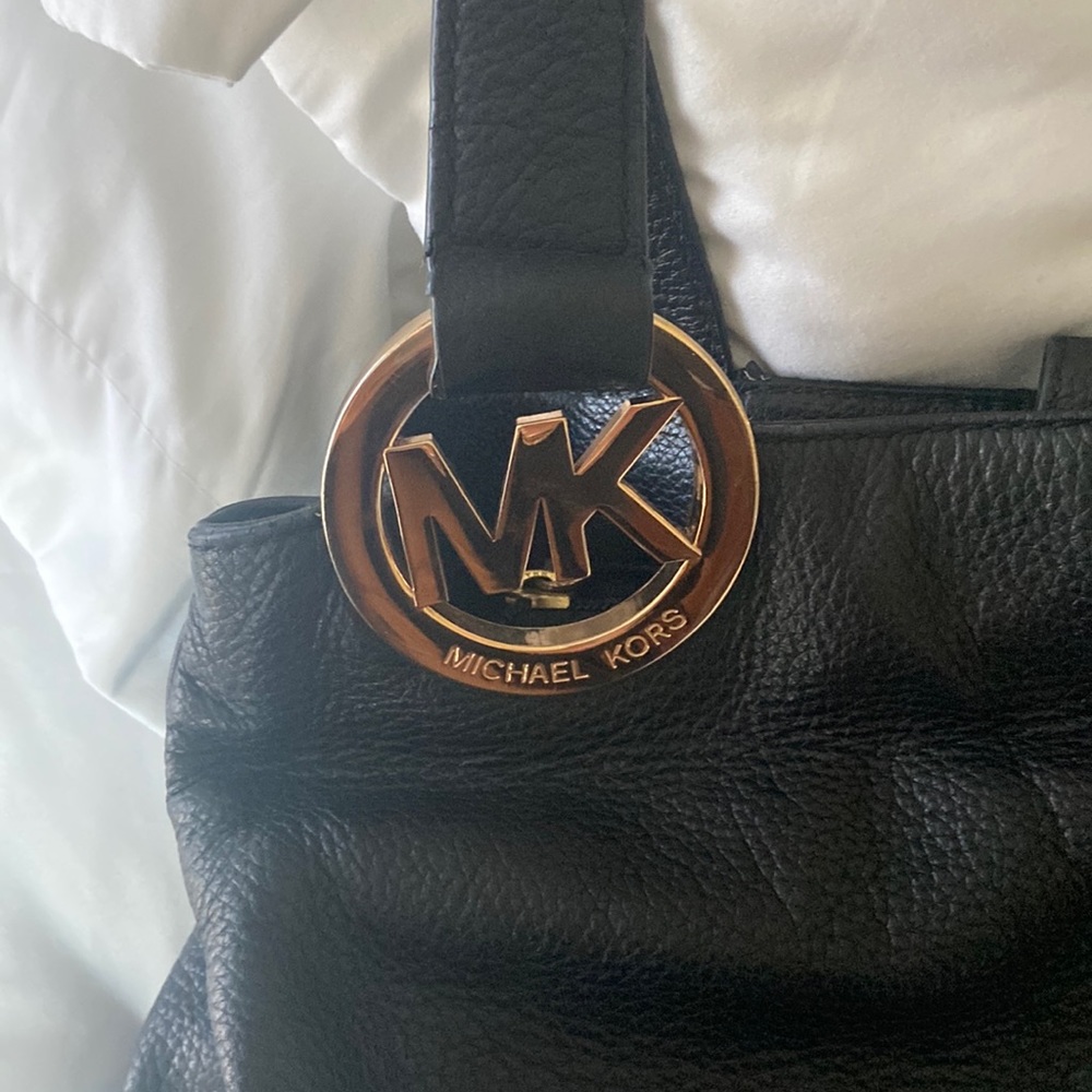 Black leather Michael Kors. Gently used. Very clean.